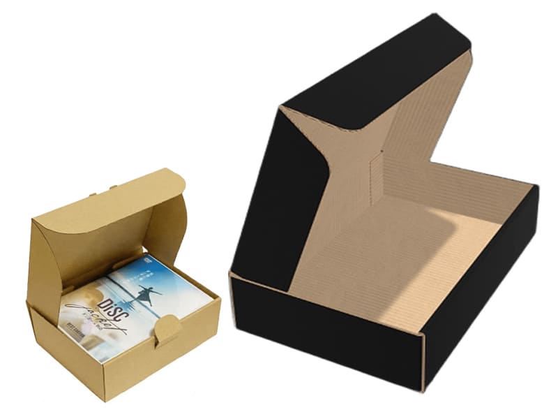 Фото чёрной подарочной самосборной коробочки и бурой с дисками